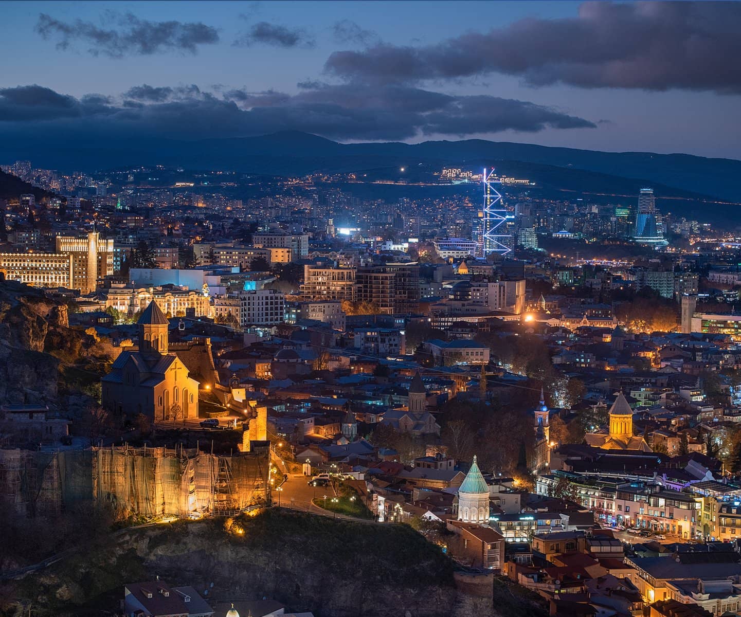 Old-town rooftops glowing at dusk