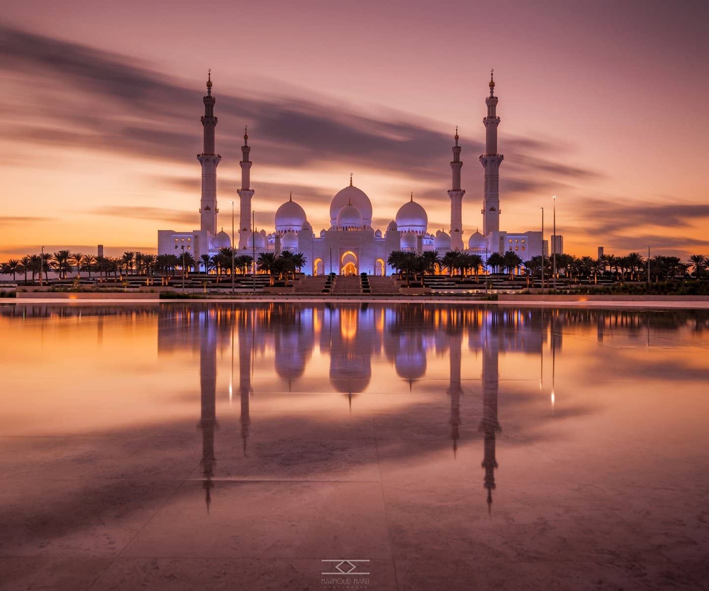 Sheikh Zayed Grand Mosque reflected at sunset