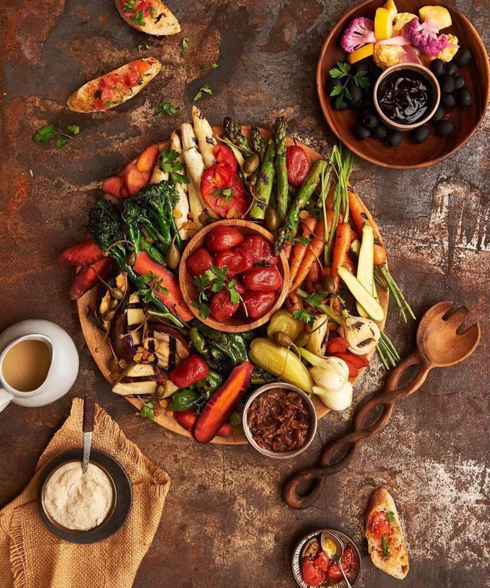Overhead of roasted vegetables on a rustic board