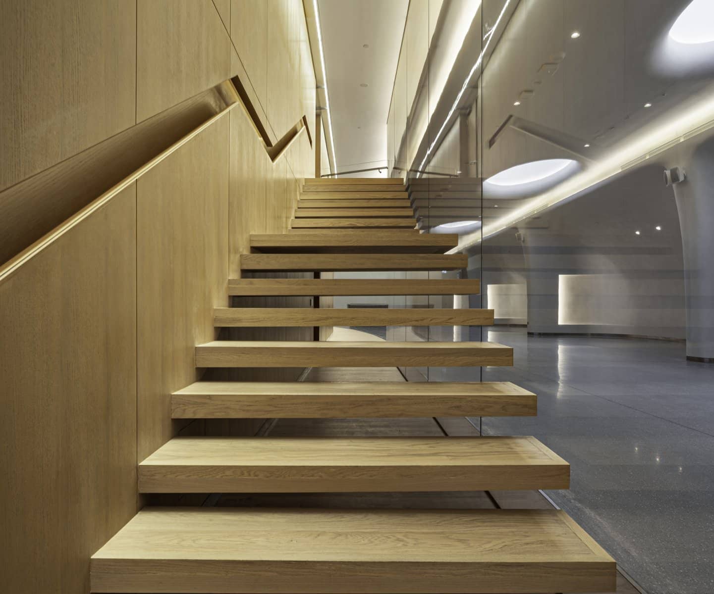 Floating timber staircase with a light slot