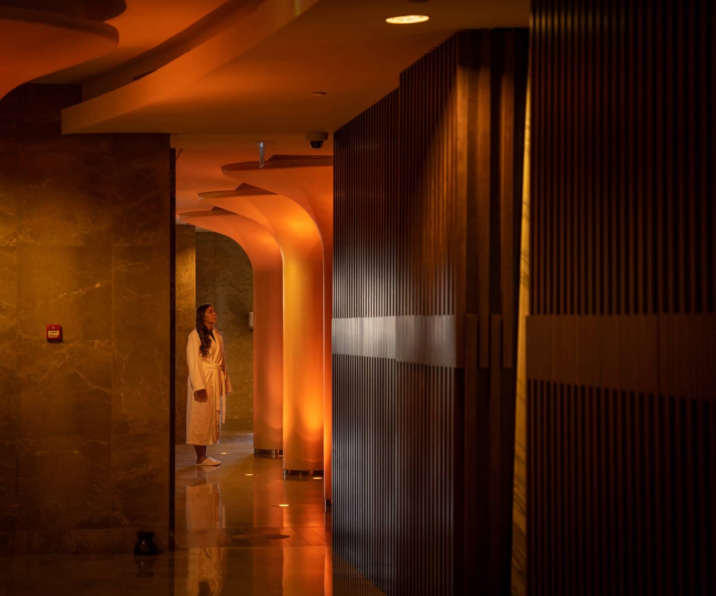 Warm hotel corridor with timber panelling