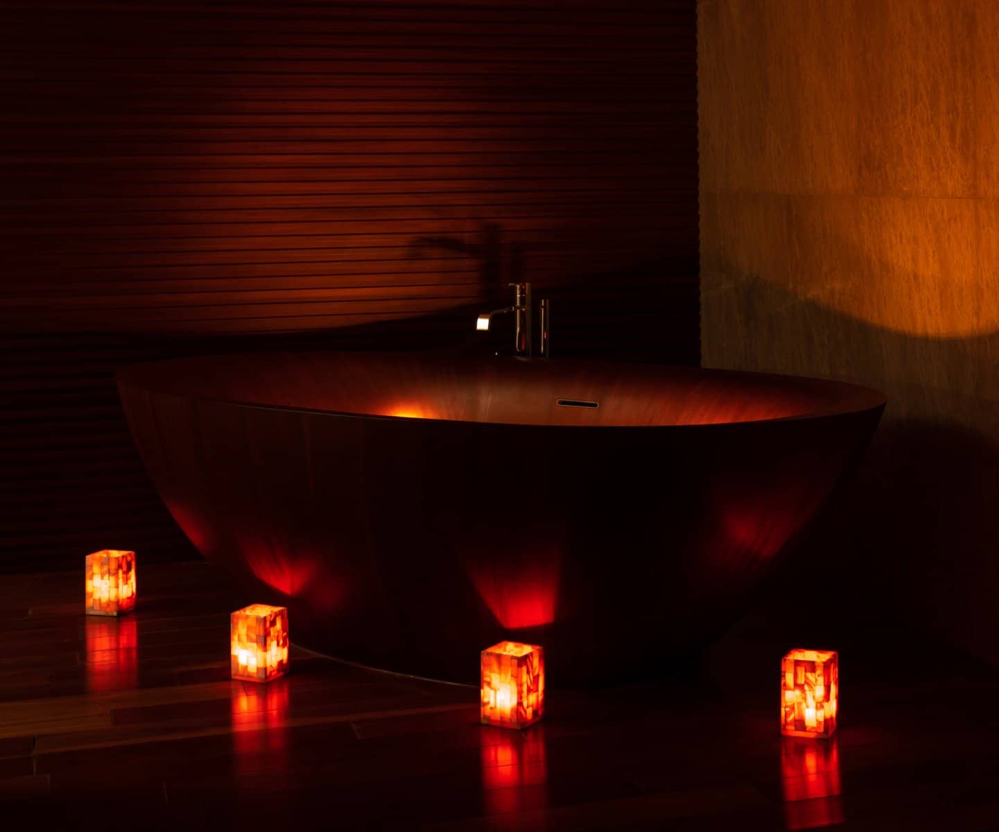 Bathtub glowing in red candlelight