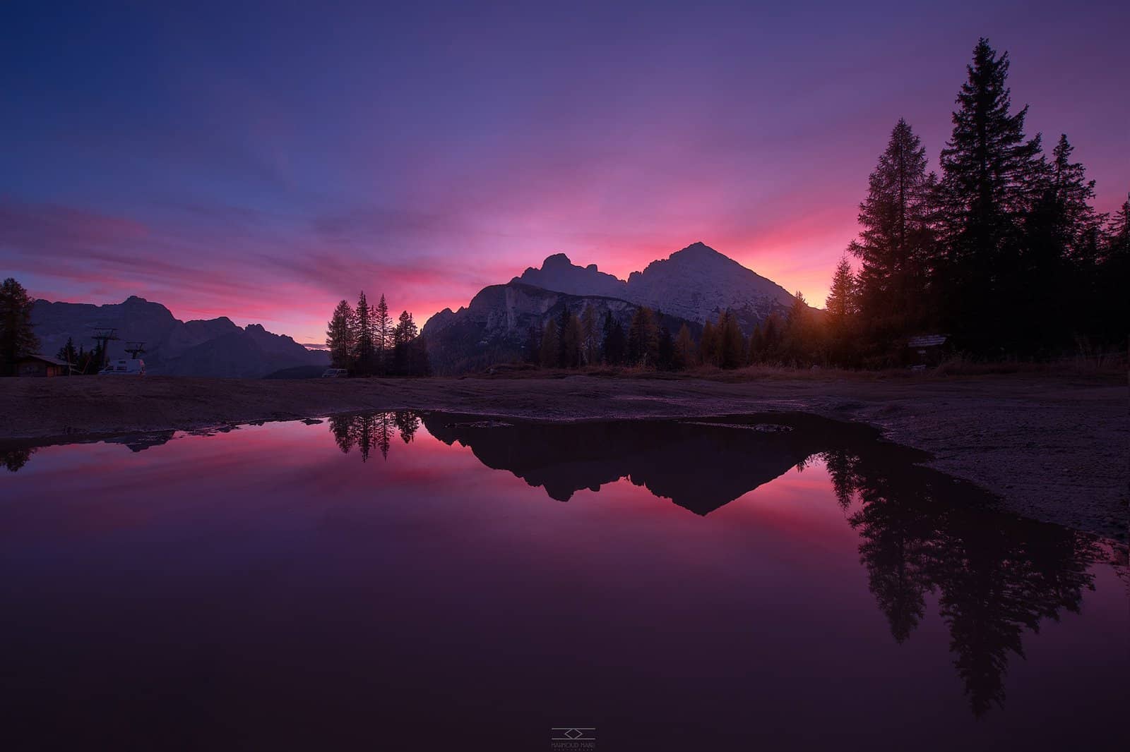 Mountain reflected in a still lake at dusk