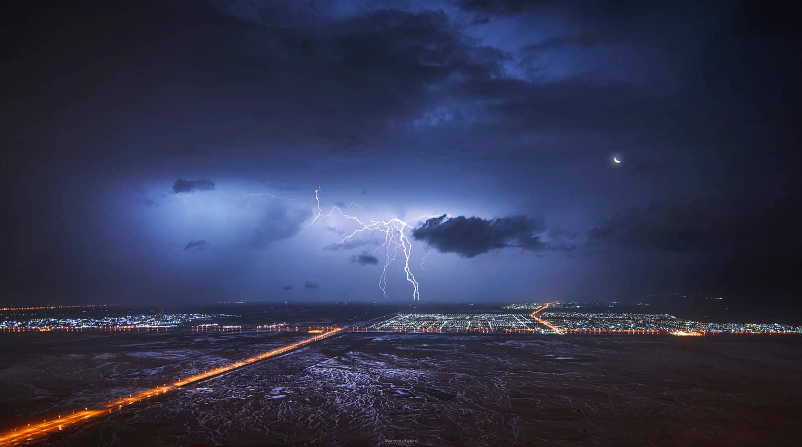 Lightning over a city at night