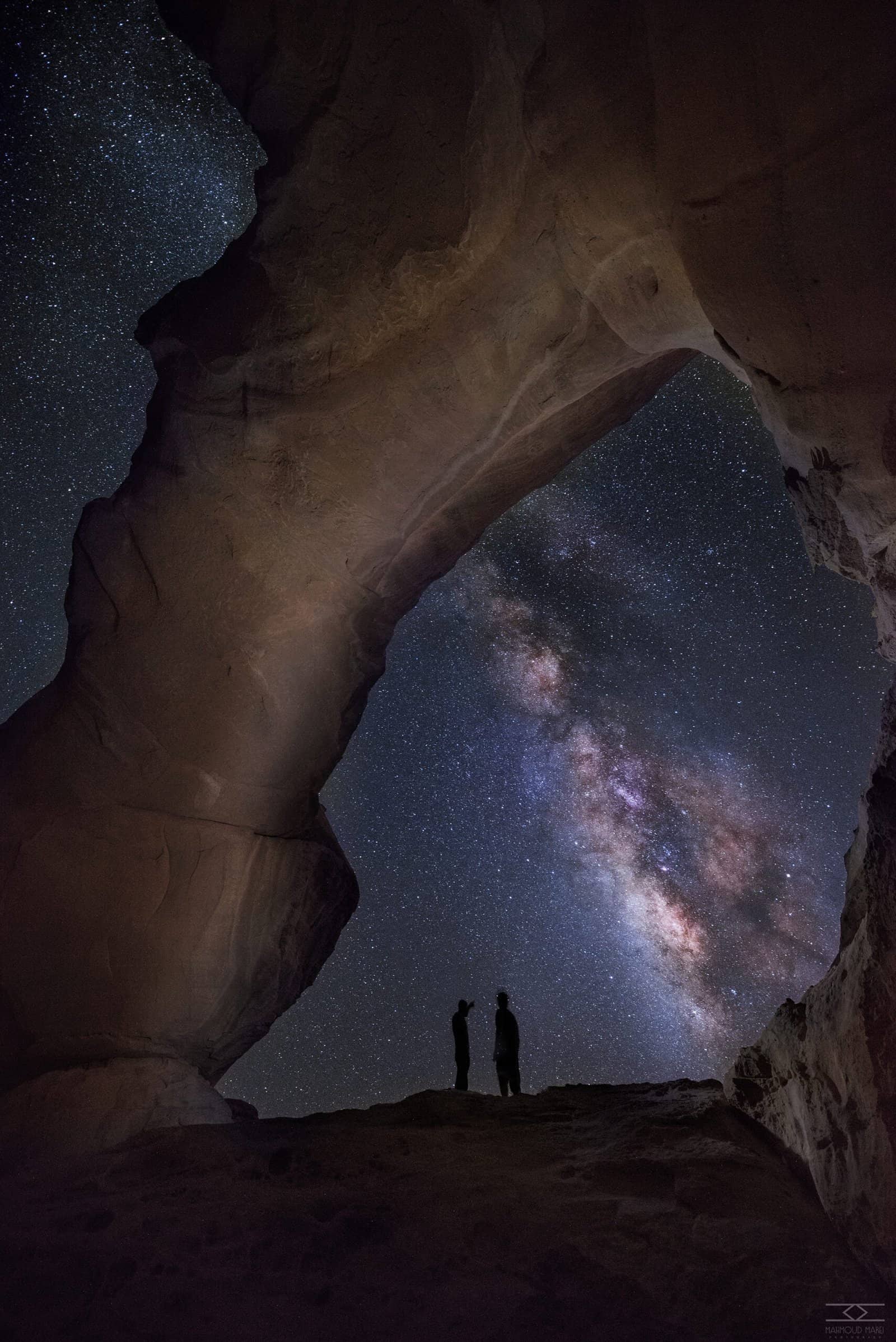 Milky Way arching over a rock bridge in Wadi Rum