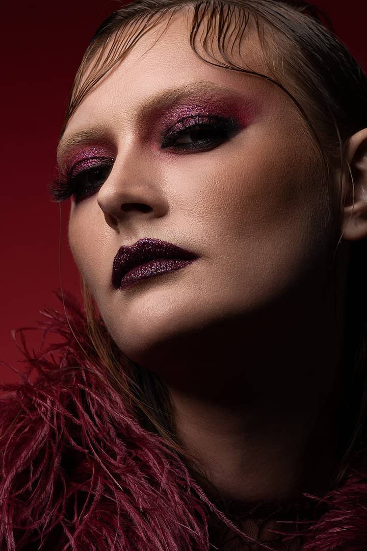 Beauty portrait with dramatic plum eye make-up