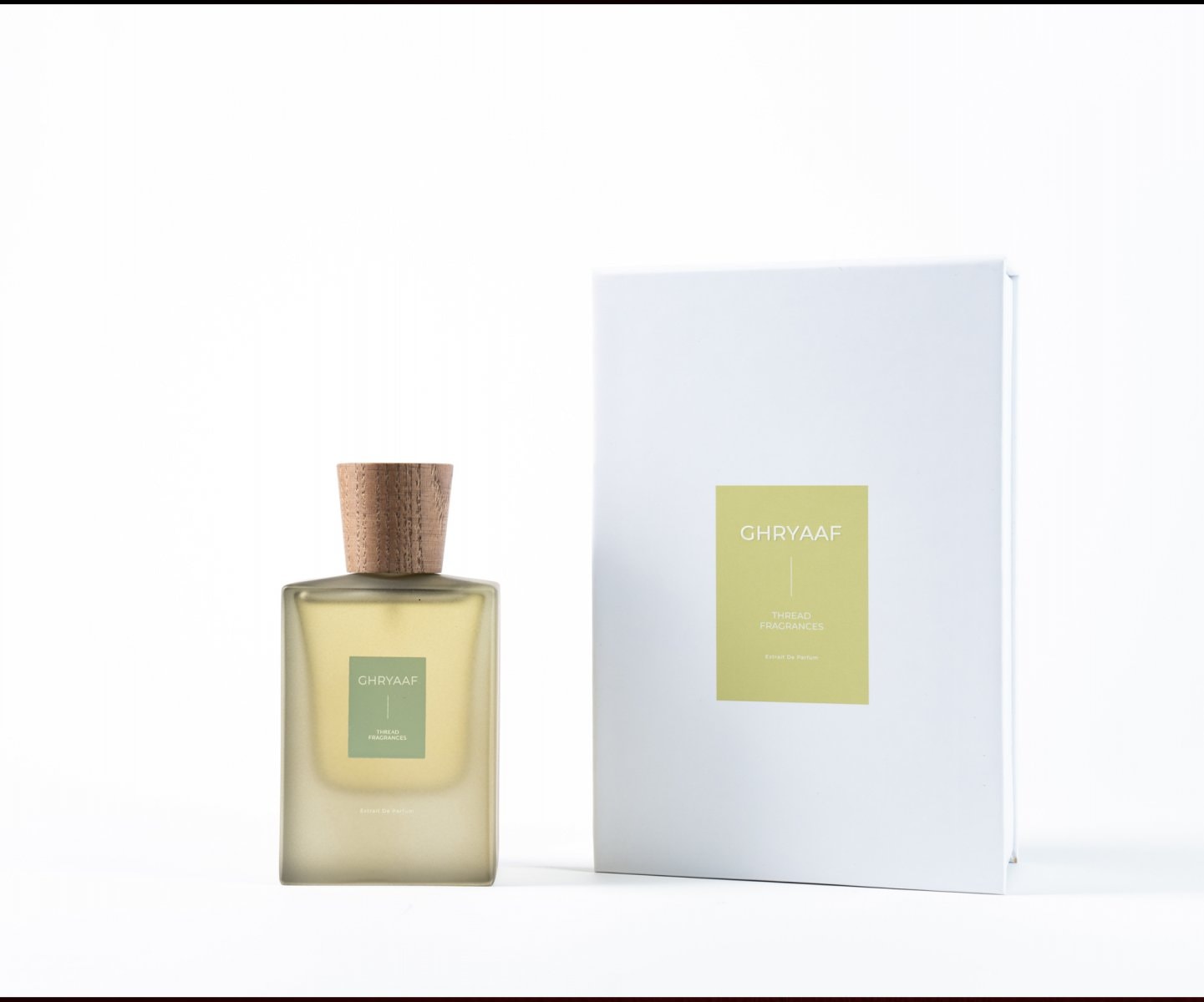 Perfume bottle and box packshot on white