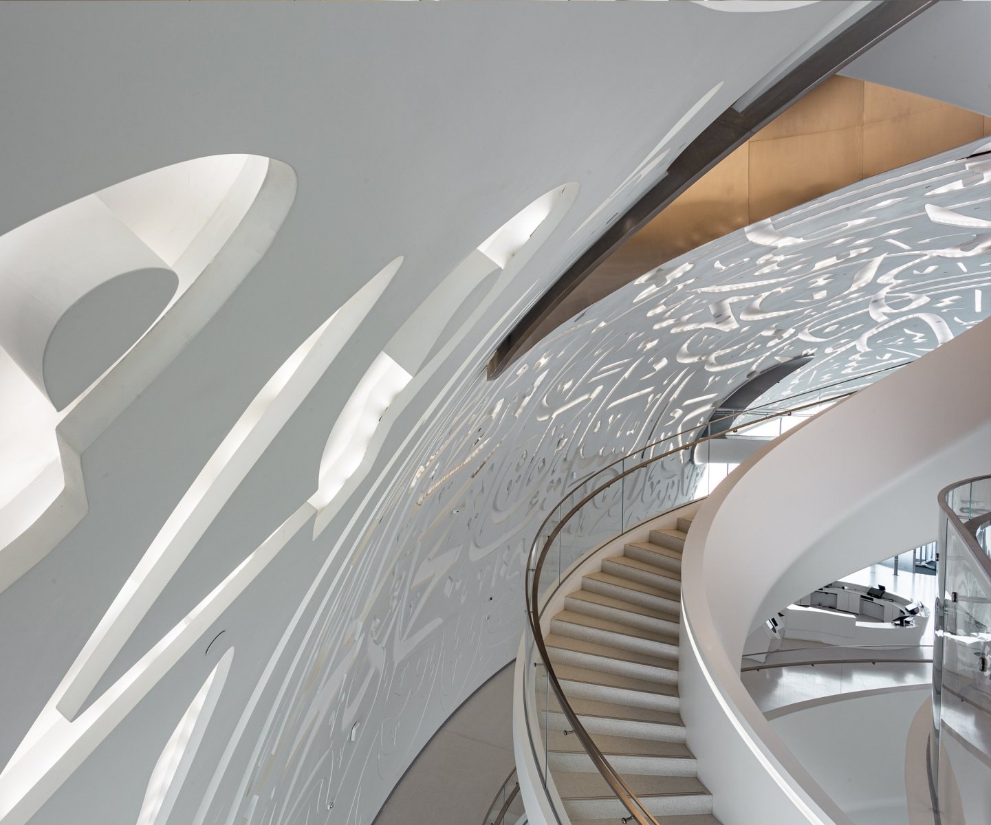Sweeping white curved architecture with a spiral stair