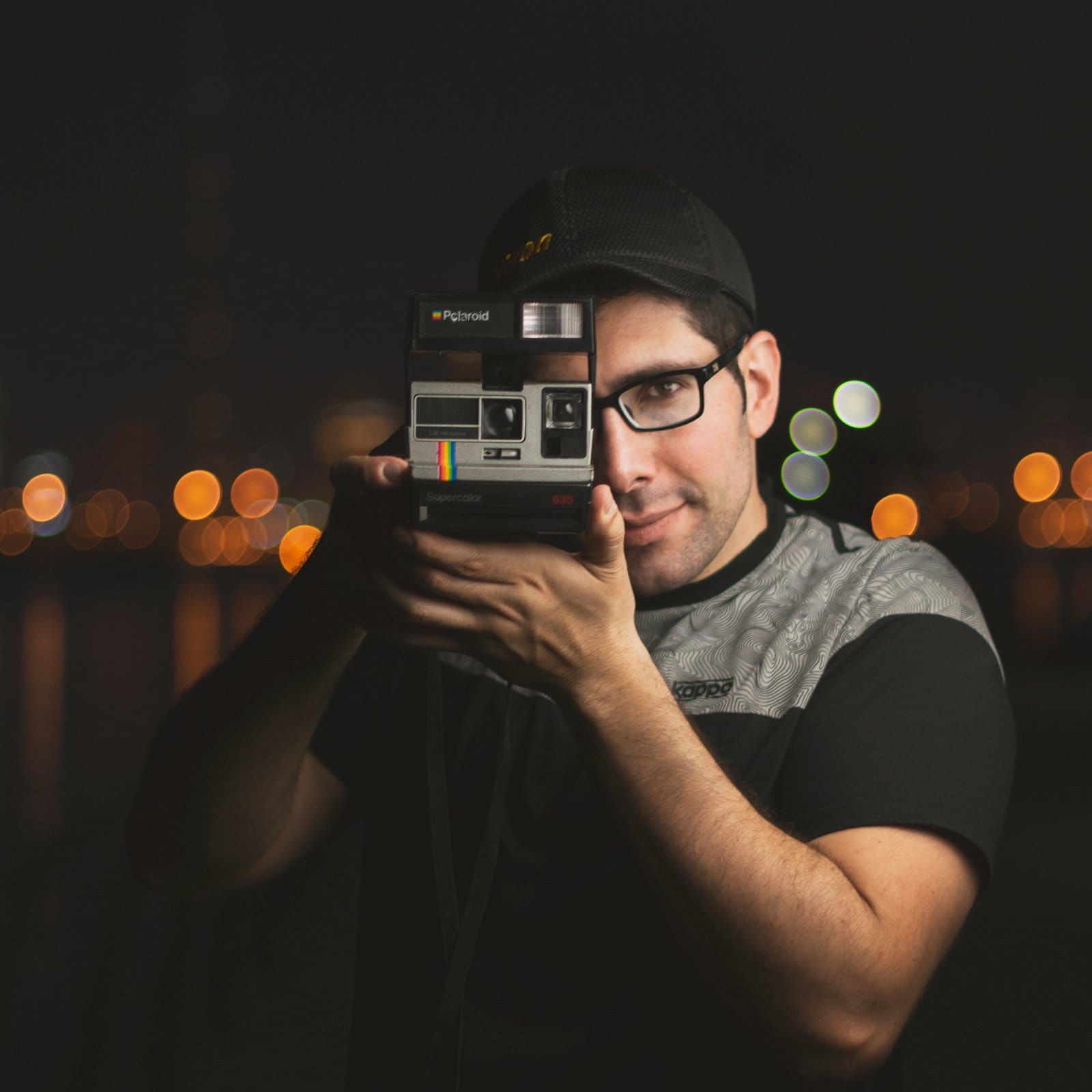 Mahmoud Marei holding a camera to his eye